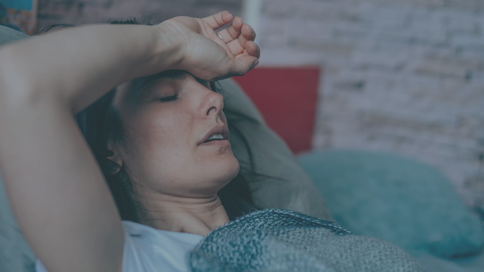 Woman sitting quietly in a calm space during trauma recovery, reflecting the slow and gradual process of nervous system healing.
