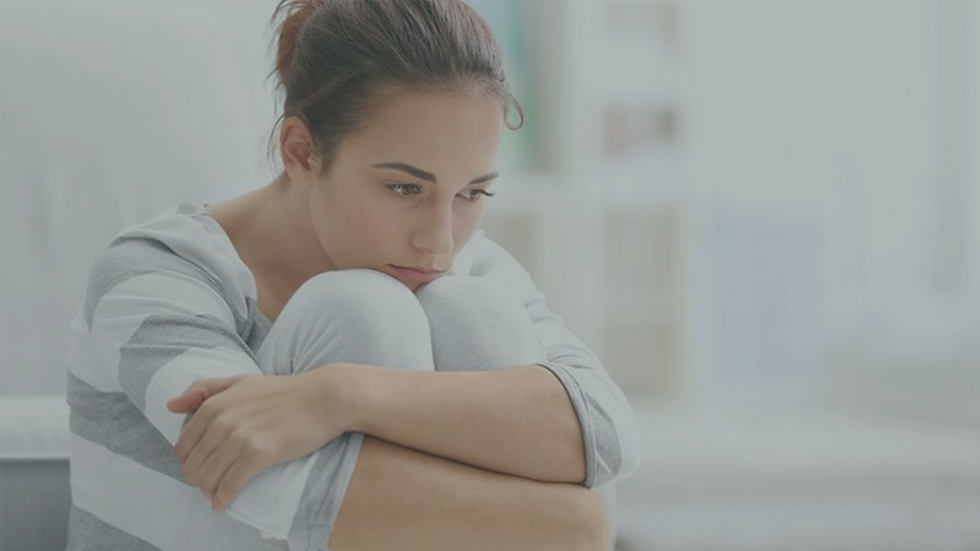 Person attempting to relax while still appearing tense and emotionally alert.