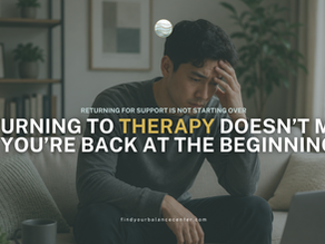 Man sitting on a couch with one hand on his forehead, looking overwhelmed while reflecting on personal challenges and considering returning to therapy for support.