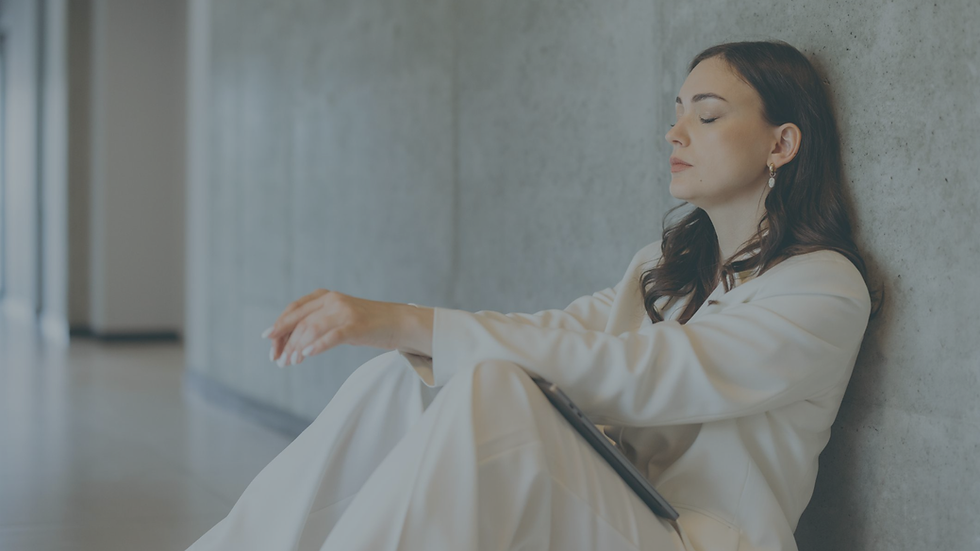 Person experiencing emotional exhaustion while carrying responsibilities and supporting others without asking for help.