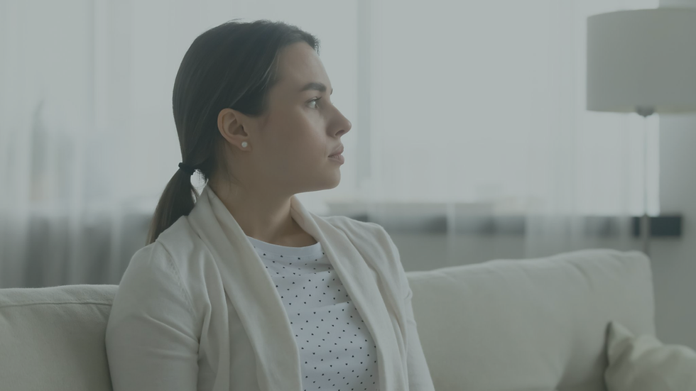 Person reflecting with a thoughtful and slightly conflicted expression, representing awareness without full emotional change