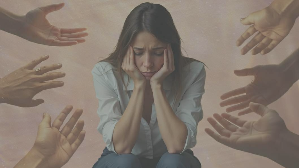 Woman sitting alone looking overwhelmed while reflecting on feelings of responsibility, self-worth, and emotional pressure.