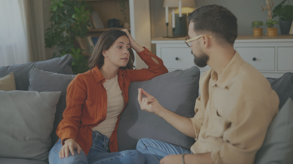 Person feeling anxious during a healthy relationship conversation while discussing conflict and emotional concerns.