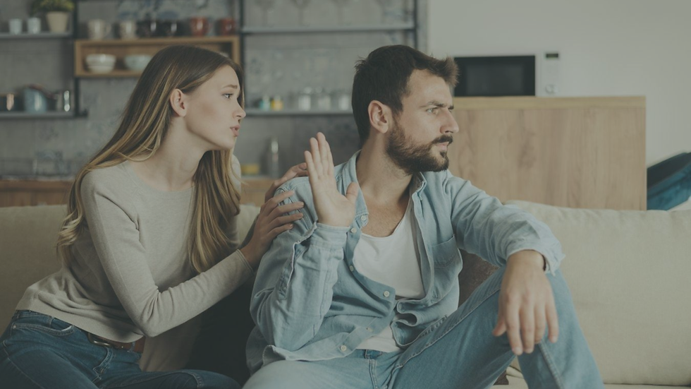 Couple sitting together while experiencing emotional distance and disconnection
