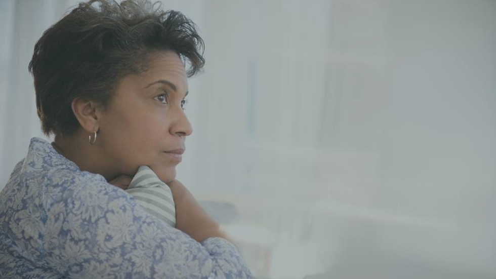 Person reflecting on personal growth while navigating a new stage of life.
