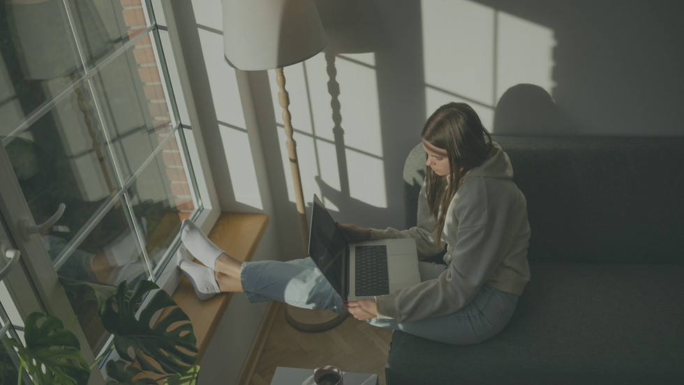 Client participating in a telehealth therapy session from home after returning to counseling support.