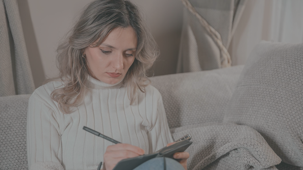 Person reflecting on emotional patterns while journaling and working toward personal growth.
