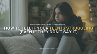 Teen girl sitting quietly on a couch at home looking emotionally overwhelmed and withdrawn.