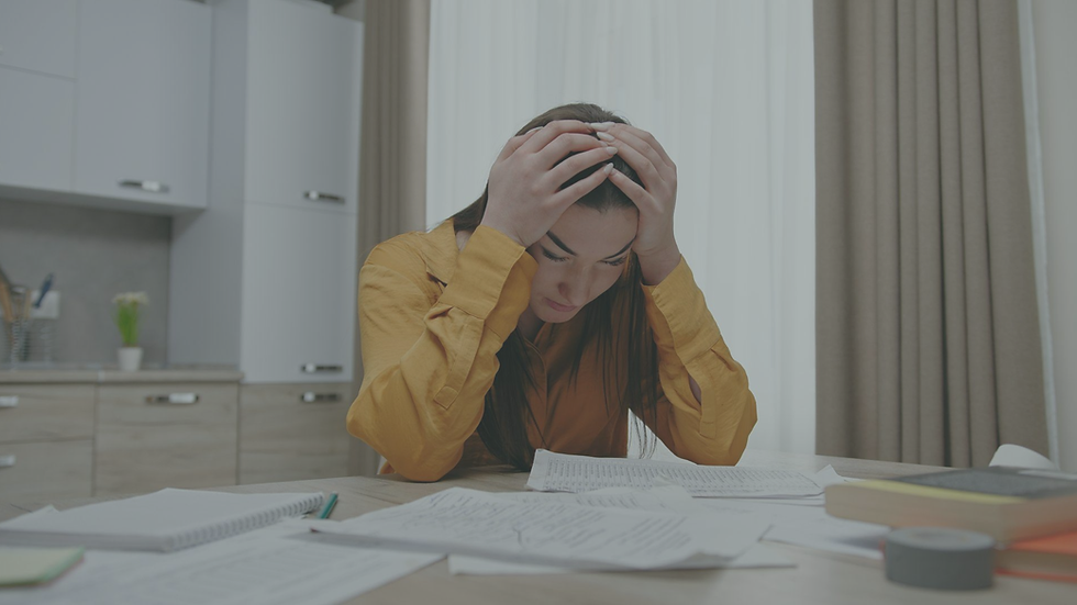 Overwhelmed professional experiencing chronic stress while working.