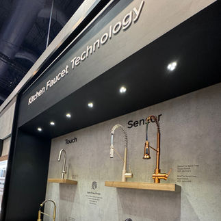 a wall of sensor kitchen faucets