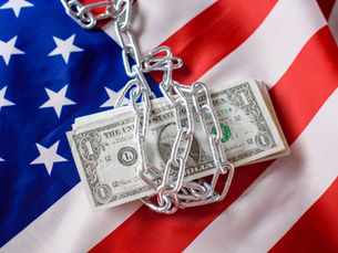 money in chains on top of american flag