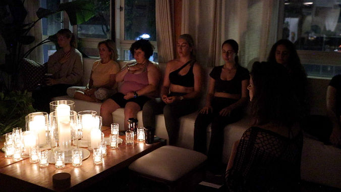 Barsi leads a candlelit intuitive workshop for women.