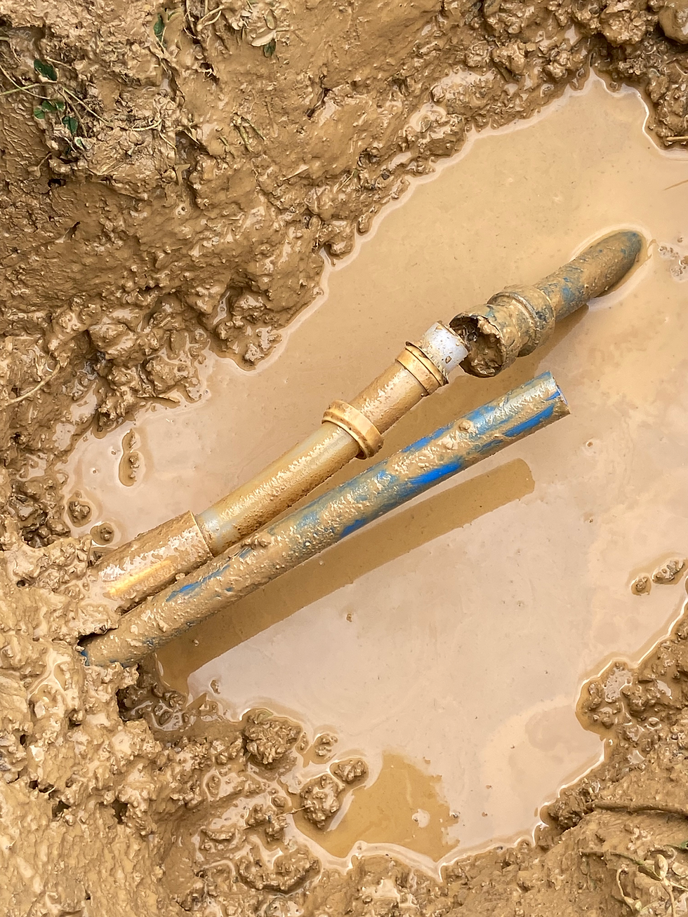 Close-up view of a emergency plumbing leaking pipe that was underground