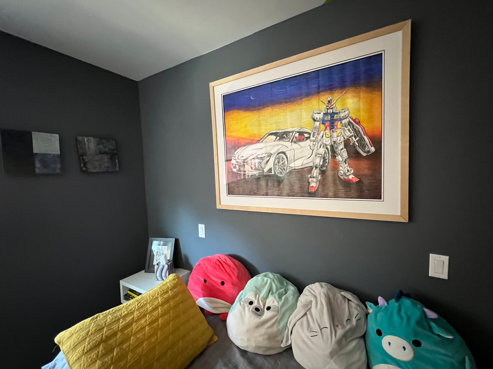 Framed colorful artwork of robot and car