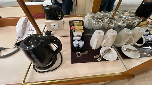 Tea and coffee tray with kettle, mugs, and ingredients inside cabin A611 on P&O Azura.
