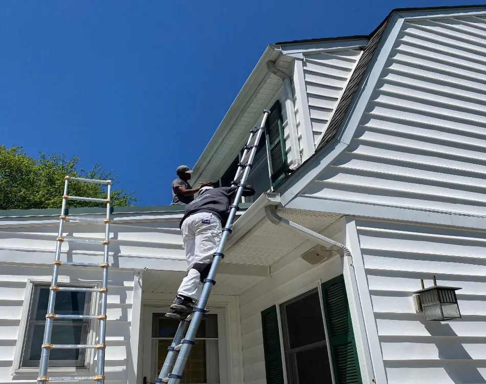 Aurora Painting team painting a house exterior