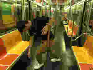 man hcausing annoyance on nyc subway train