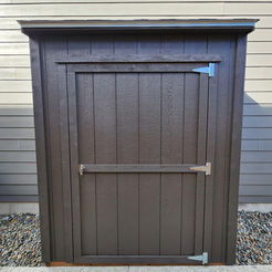 dark colored lean-to style shed