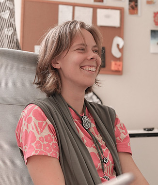 Linnea sitting in office chair, a photo by Stefan.