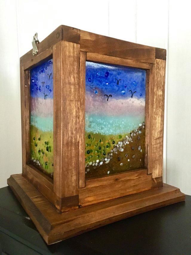 Glass and wood lantern