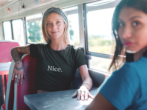 Nice tshirt on woman on a vintage bus with a friend
