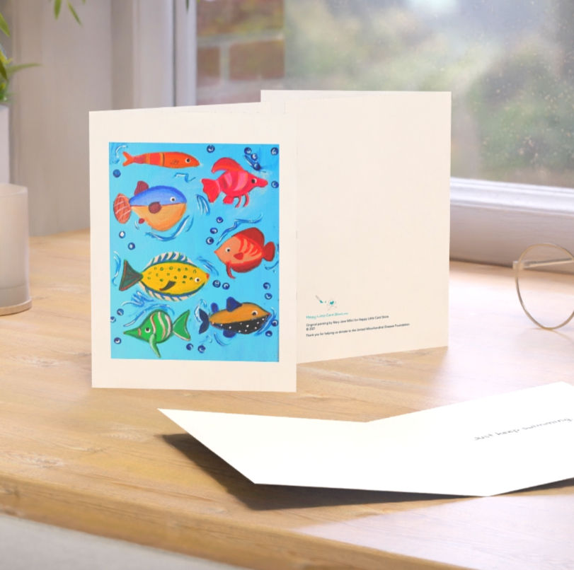 Thumbnail: Just Keep Swimming Friendly Fish Card shown on a desk in a home with a pen