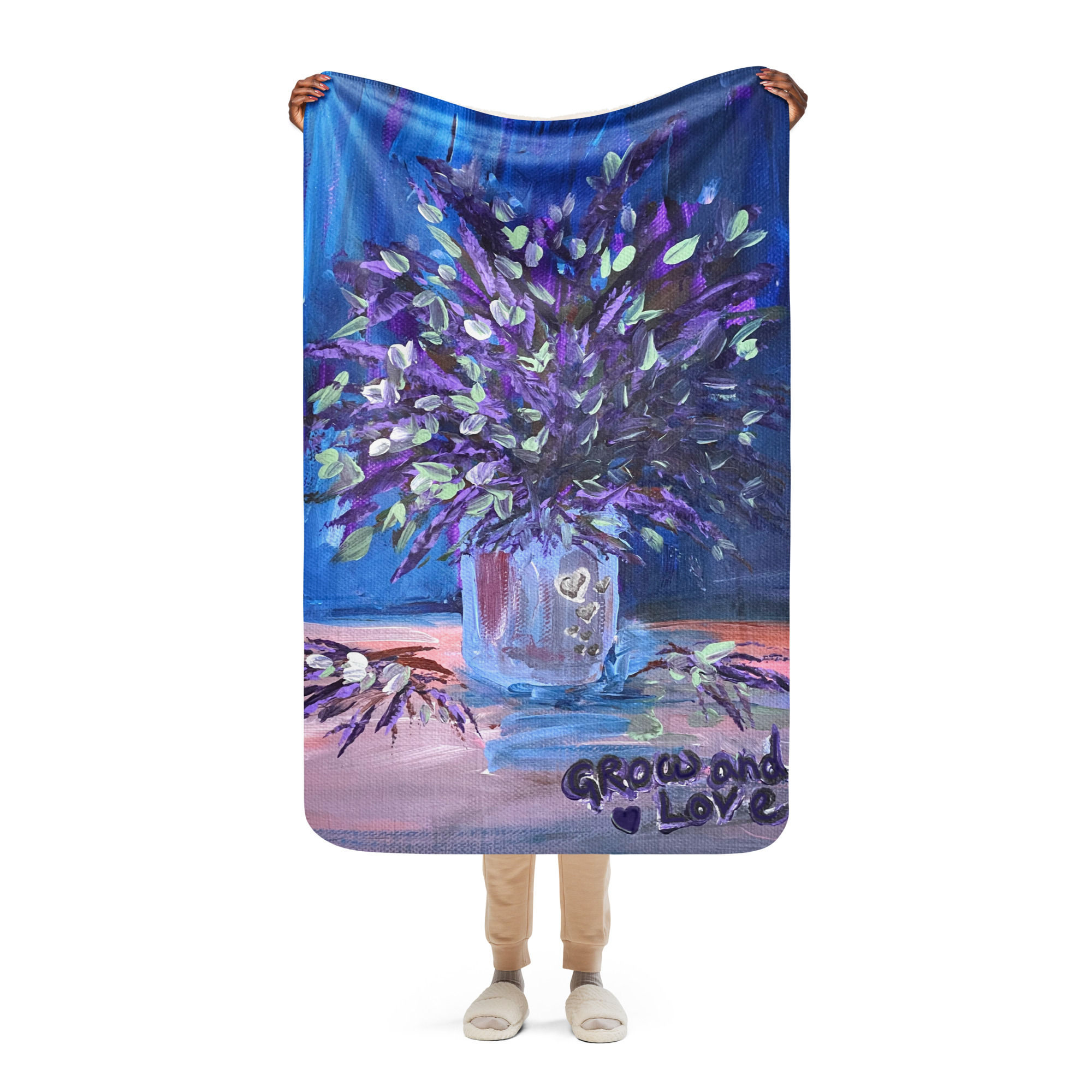 Grow and Love Lavender Sherpa Blanket shown full view being held up by a woman