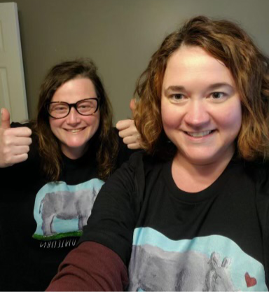 Thumbnail: Chubby Unicorn Rhinoceros T-shirts on happy women customers giving a thumbs up