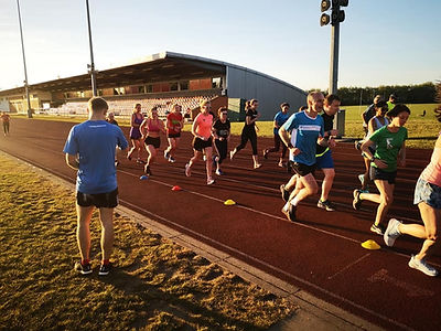 Queens Park Harriers runners training at Willesden Sports Centre track