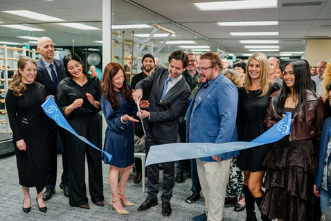 Ribbon-cutting ceremony with team at Seattle business launch
