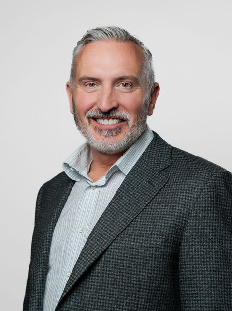 headshot of man with sport coat on grey background- tiffany stumpf photography