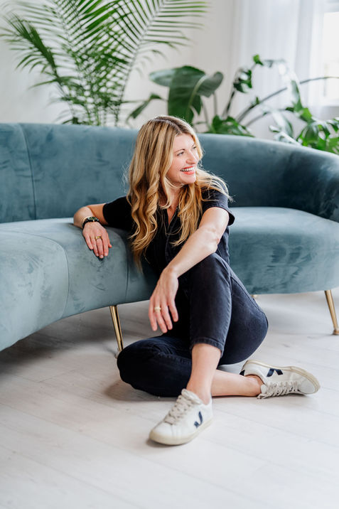 Lifestyle brand portrait of healthcare entrepreneur seated casually