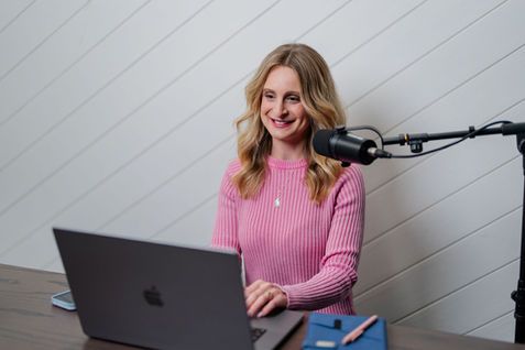 Business coach recording podcast episode in home studio for Seattle brand photography