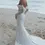 Thumbnail: Bride in white dress on beach Bow Two Tier Veil Wedding day and she loves