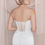 Thumbnail: Bride in wedding dress, back view, delicate lace and corset, elegant style