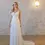 Thumbnail: Woman in white wedding dress, Chosen by Khya, Orelle, standing in a studio.