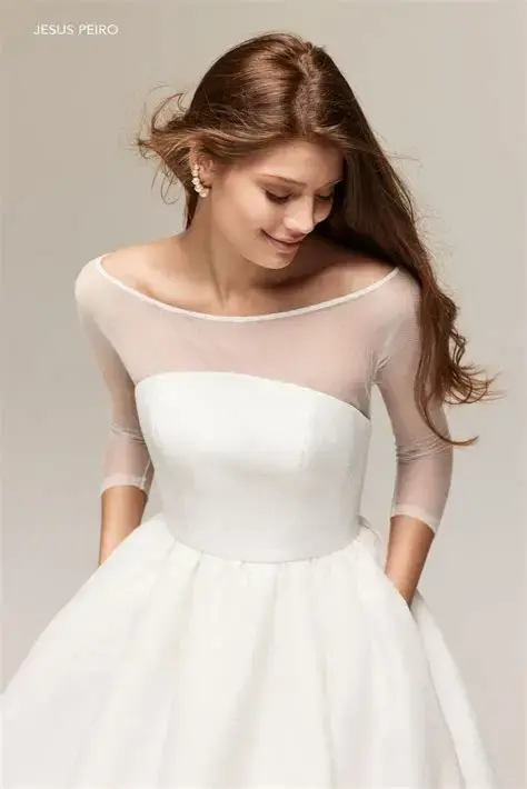 Thumbnail: Young woman in a white wedding dress, Alena Leena, Jade, smiling gracefully.