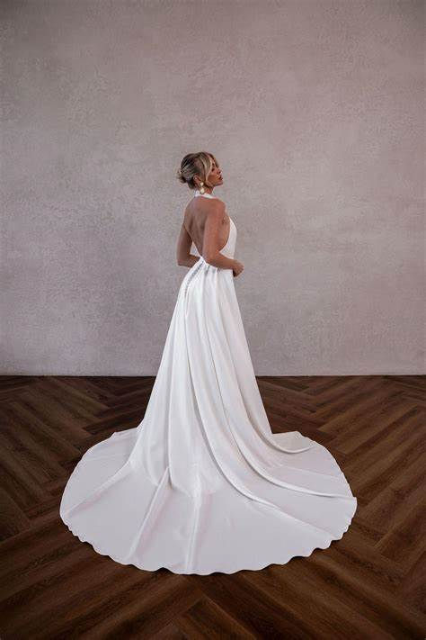 Thumbnail: Made with Love Grayson halterneck fitted wedding dress with overskirt