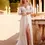 Thumbnail: Stunning bride in off-shoulder lace dress with high slit outdoors. And She loves bridal boutique in berkshire 
