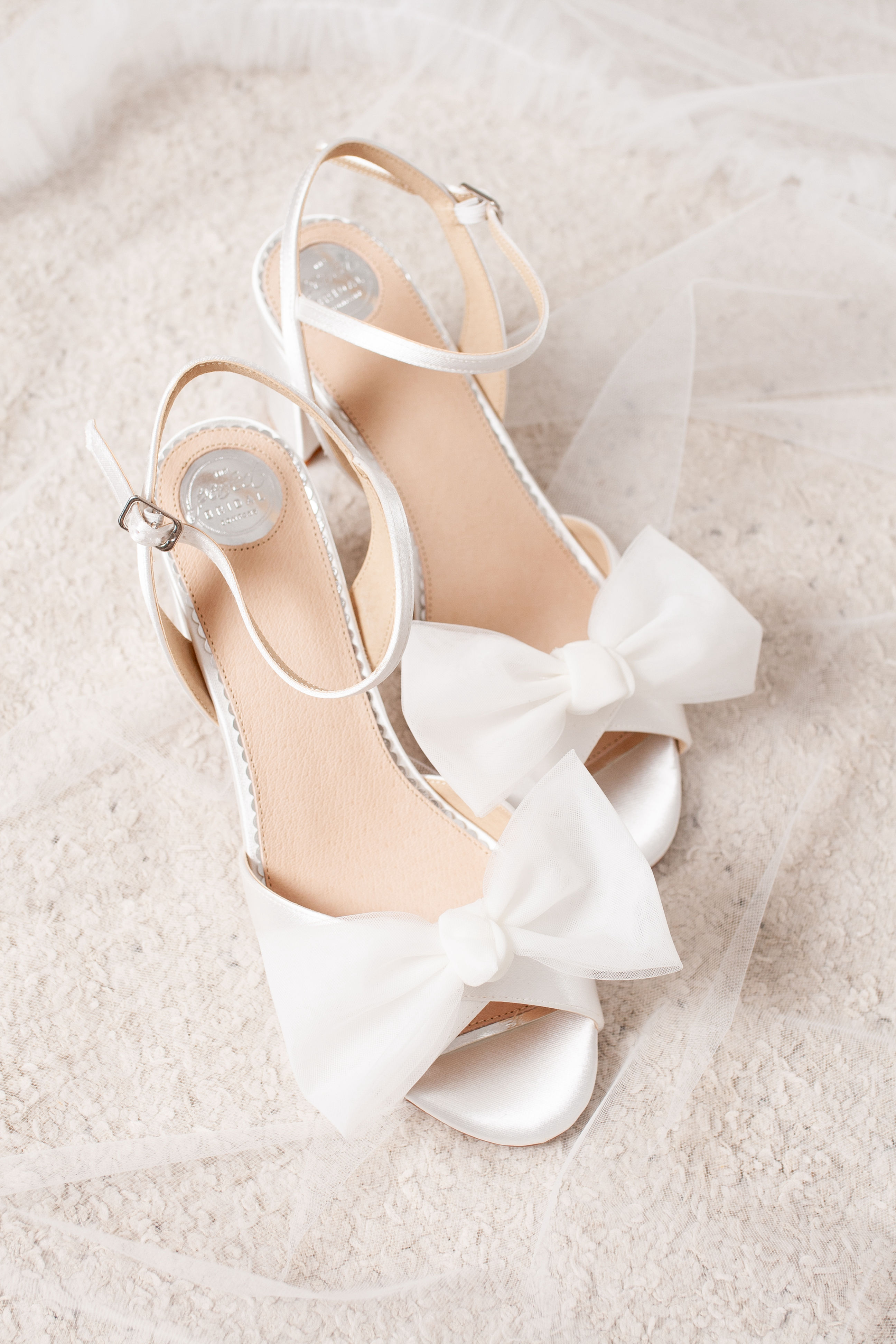 White bridal sandals with bows for Stella York 7924 gown