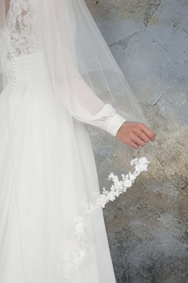 Bride's arm, white dress, Floral Edge 3D Petal Cathedral veil.