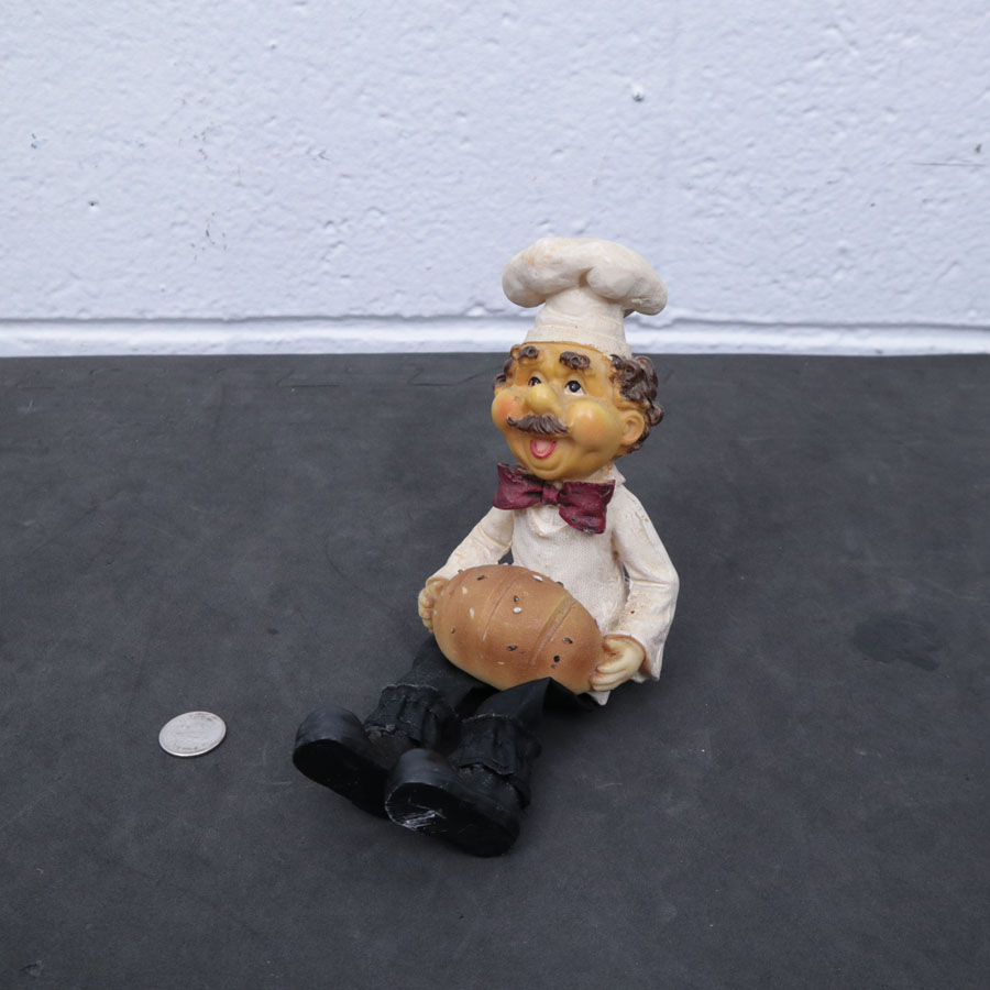 Figurine de boulanger assis