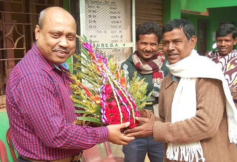 Dr. Sibnath Mandal receiving a token of appreciation from the local community