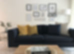 A gallery wall behind sofa