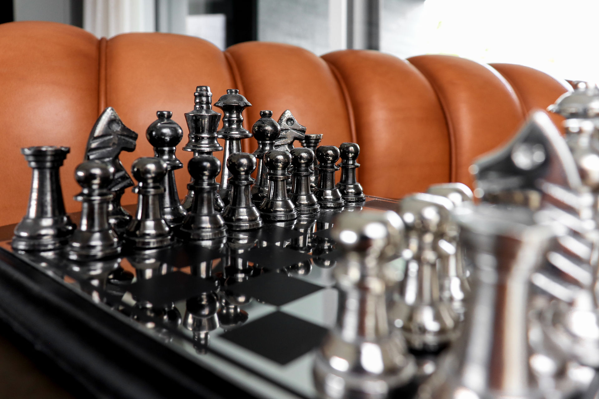chess set and leather sofa 