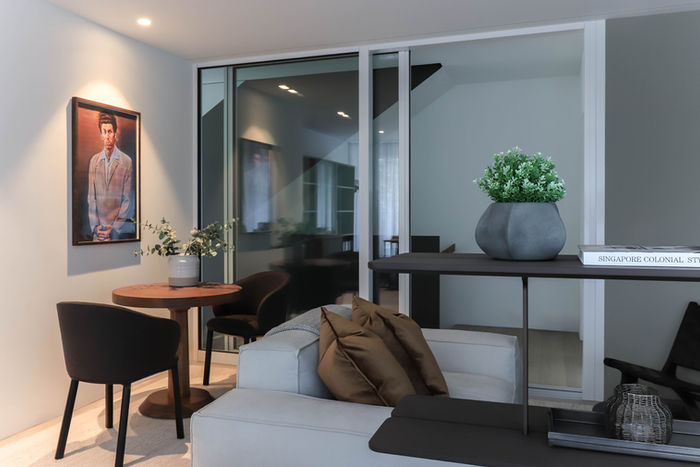 Custom home office in rental property, Zug Switzerland — built-in shelving and window desk.