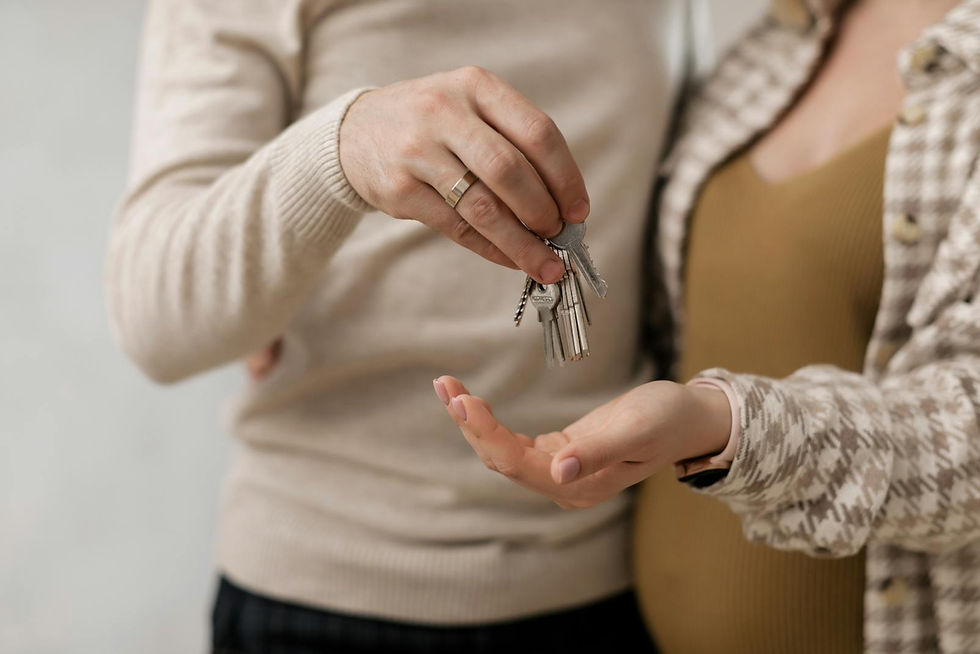 New owners holding keys to a home in Henrico County, VA