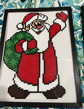 Perler bead art santa with toy bag