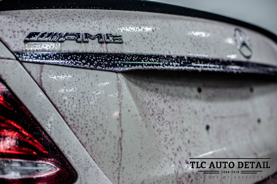 A white BMW AMG undergoing a signature wash and wax detail with added protection