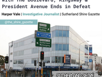 Street intersection with traffic signs for Kingsway, President Ave in front of a glass building. Headline reads: Just In: Local Man's 8-Year Battle With The Boulevard, Kingsway and President Avenue Ends in Defeat. Sutherland Shire Gazette 